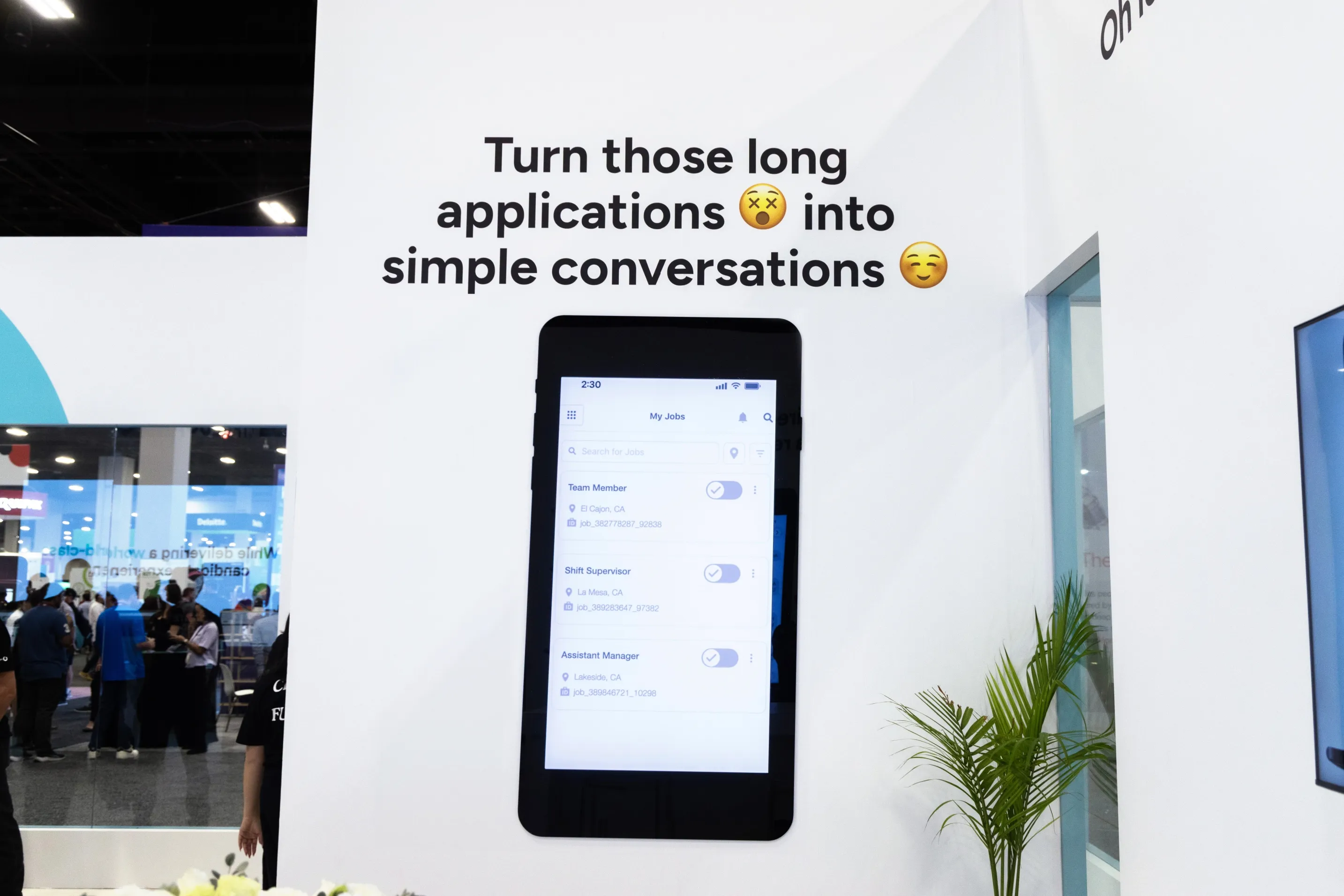 A Paradox booth display reading "Turn those long applications into simple conversations."