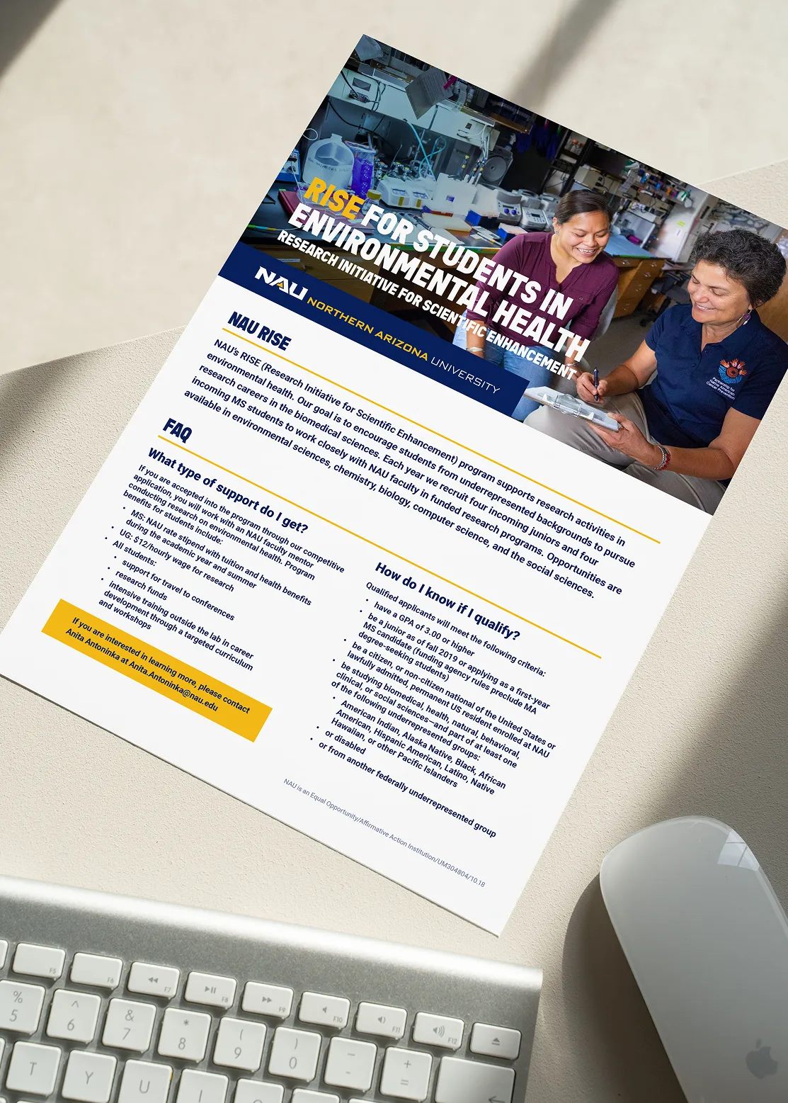 An NAU flyer about jobs for students in environmental health, beside a keyboard.