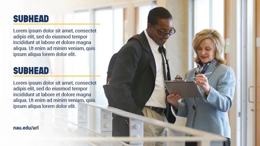 Woman in blue blazer shows clipboard to young man with backpack in bright hallway.
