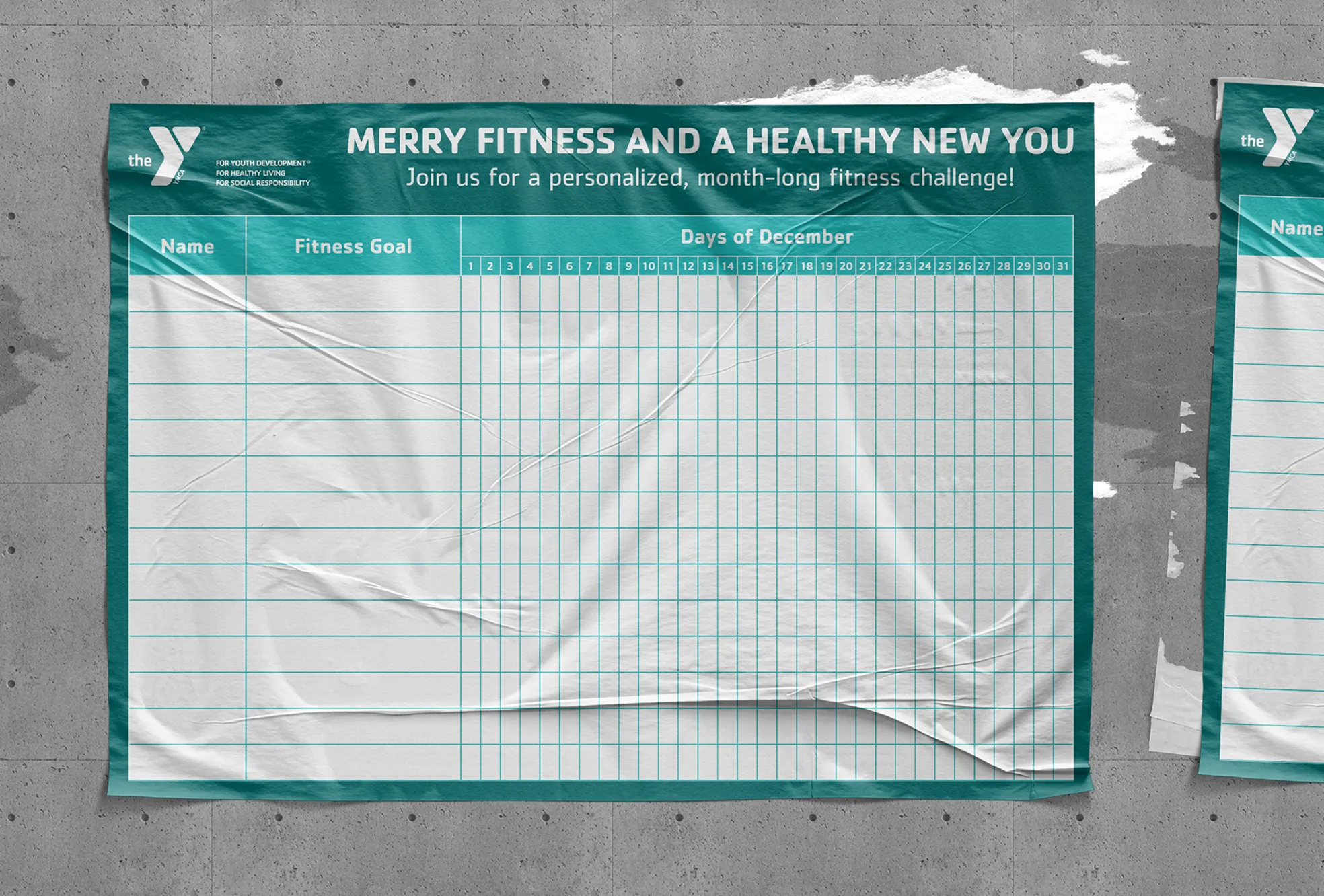 A YMCA "Merry fitness and a healthy new year" banner mounted on a fence.