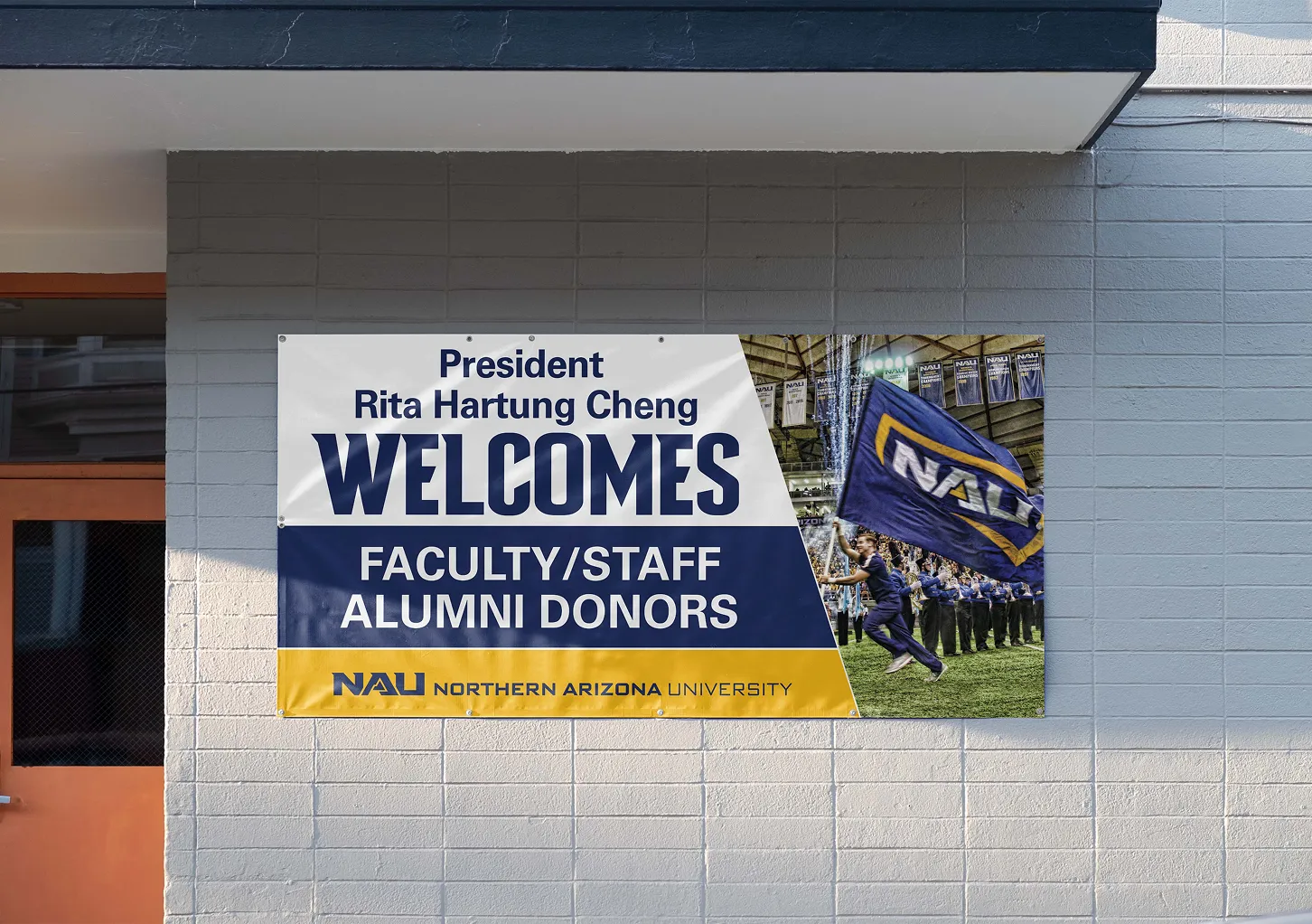 A building banner reading "President Rita Hartung Cheng welcomes faculty, staff and alumni donors".