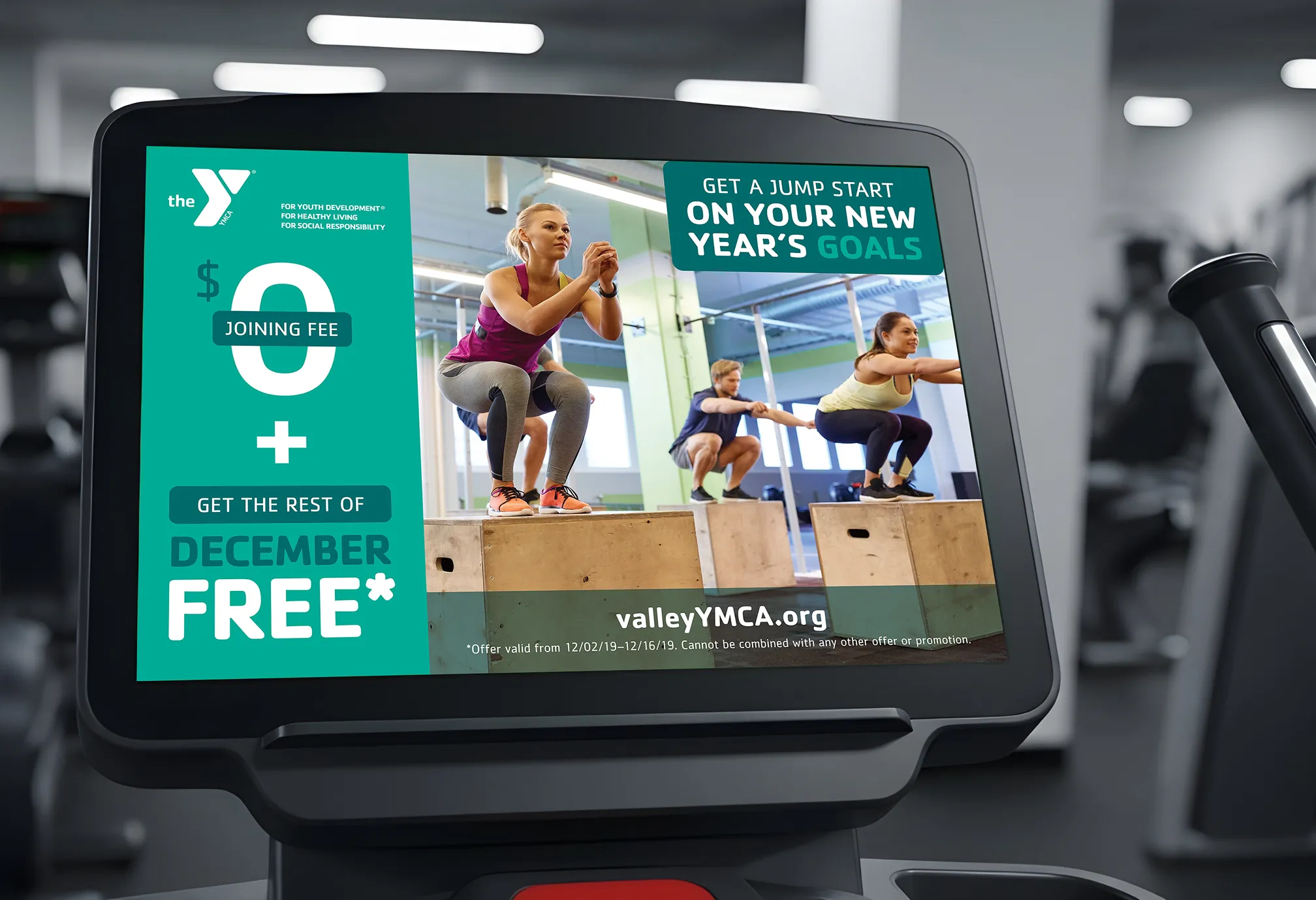 A gym equipment screen displaying a YMCA "Get a jump start on your New Year's goals" advert.