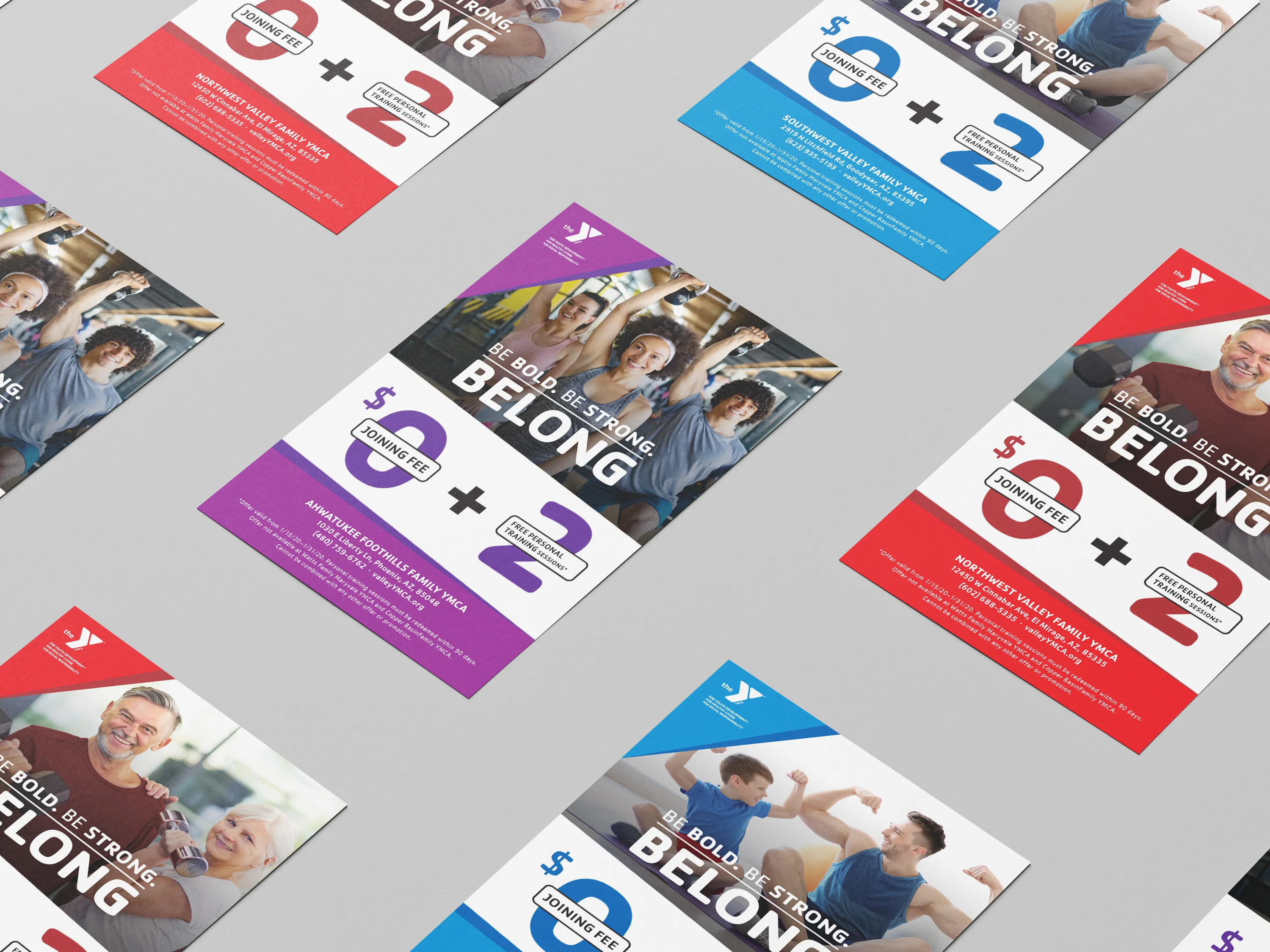 YMCA "Belong" membership flyers in several colourways arranged diagonally on grey.