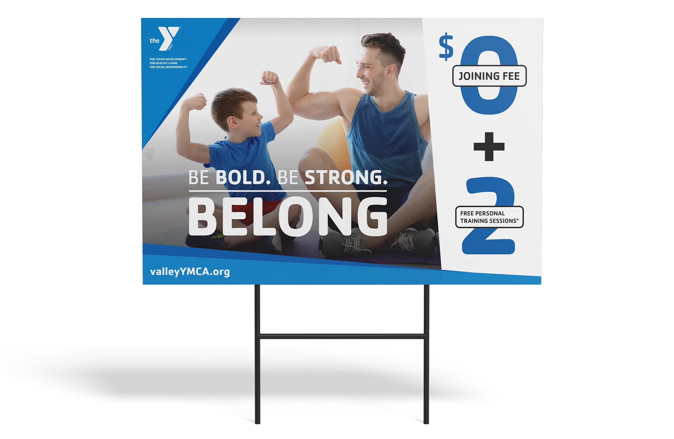 A YMCA lawn sign in blue reading "Be Bold. Be Strong. Belong." with a $0 joining fee.