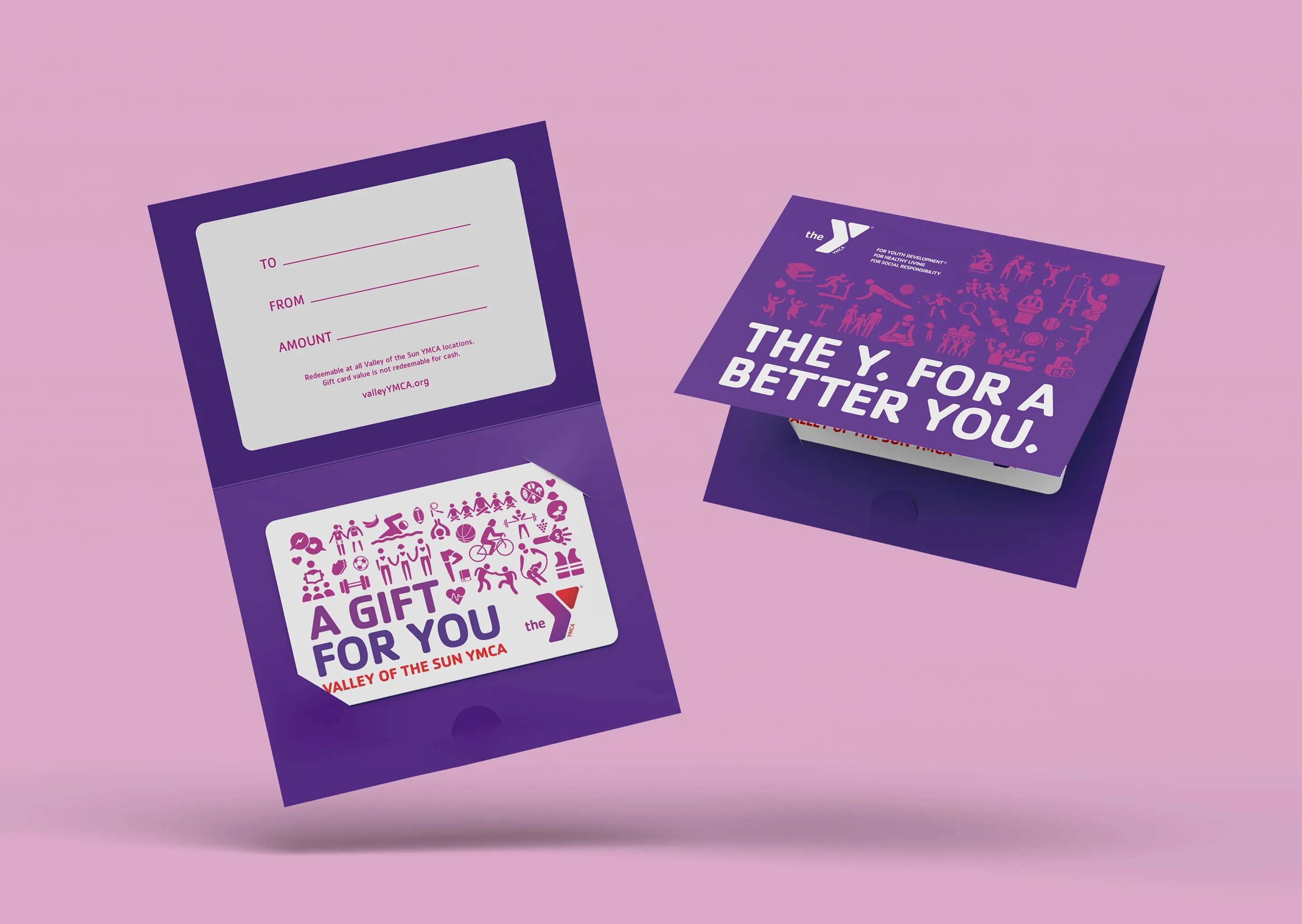 YMCA gift cards and holders in purple, one reading "The Y, for a better you".