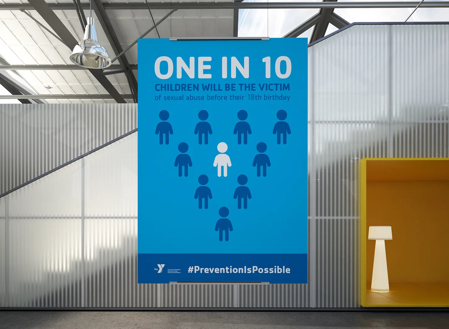 A blue YMCA awareness poster headed "One in 10", using figure icons.