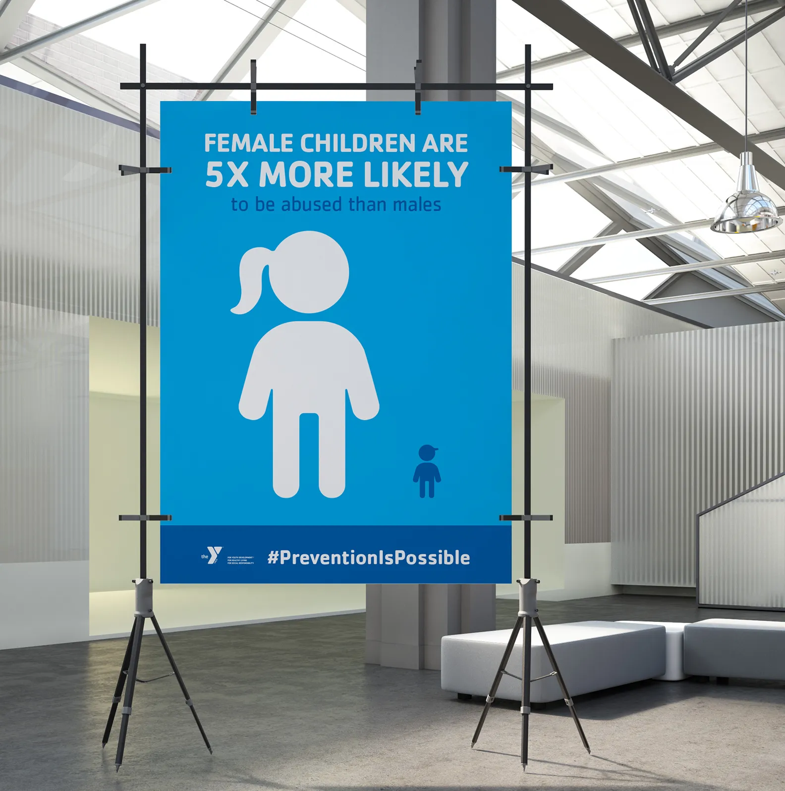 A YMCA standing banner presenting a prevention awareness statistic, tagged #PreventionIsPossible.