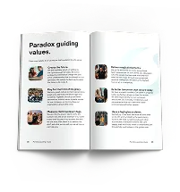 An open program spread headed "Paradox guiding values", listing six values with small photographs.