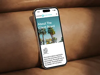 A phone propped on a leather sofa showing the Paradox Client Board "About The Client Board" page, headed by a photograph of palm trees.