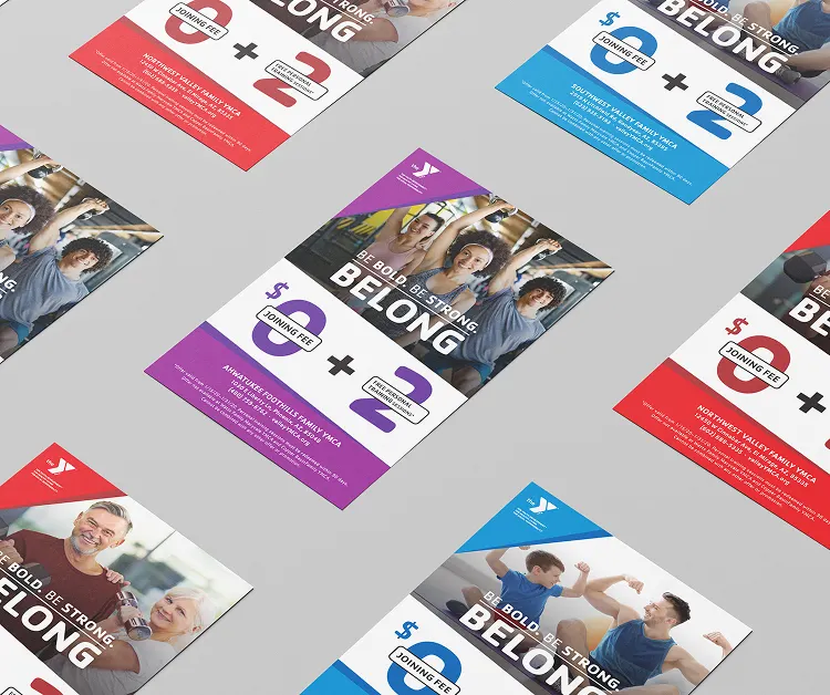 A wider arrangement of YMCA "Belong" campaign flyers in multiple colourways.