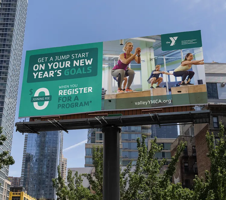 A YMCA billboard reading "Get a jump start on your New Year's goals" with a register button.
