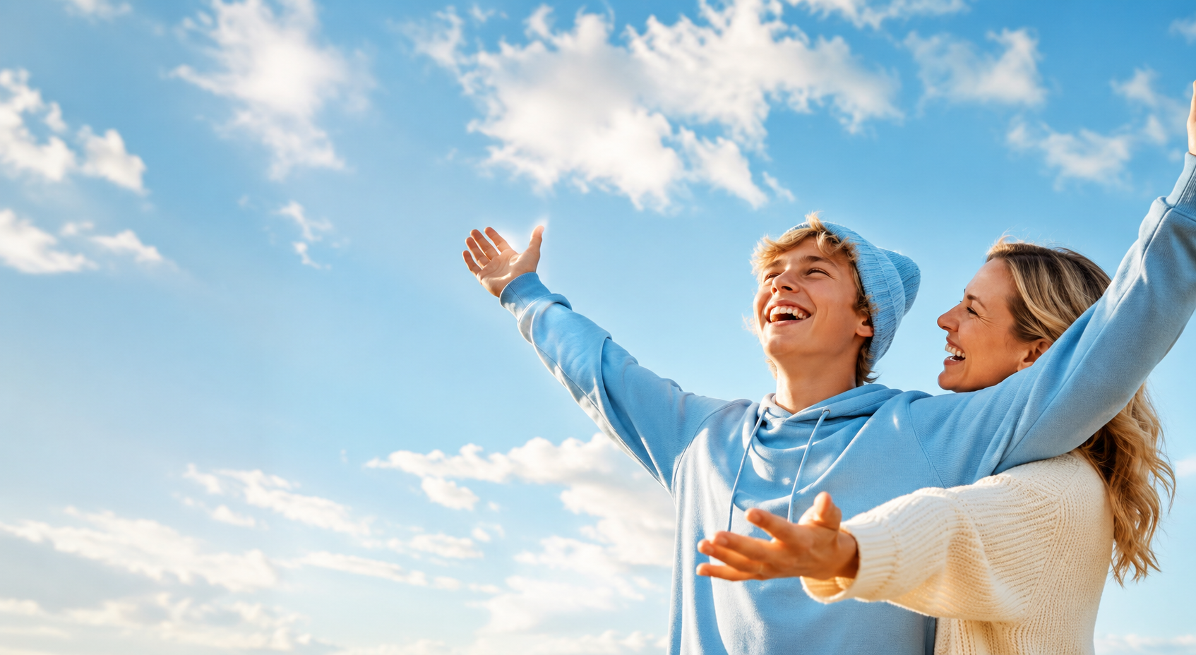 Happy teenage boy and his mother enjoying healthy breathing after airway orthodontic treatment in Kissimmee, FL.