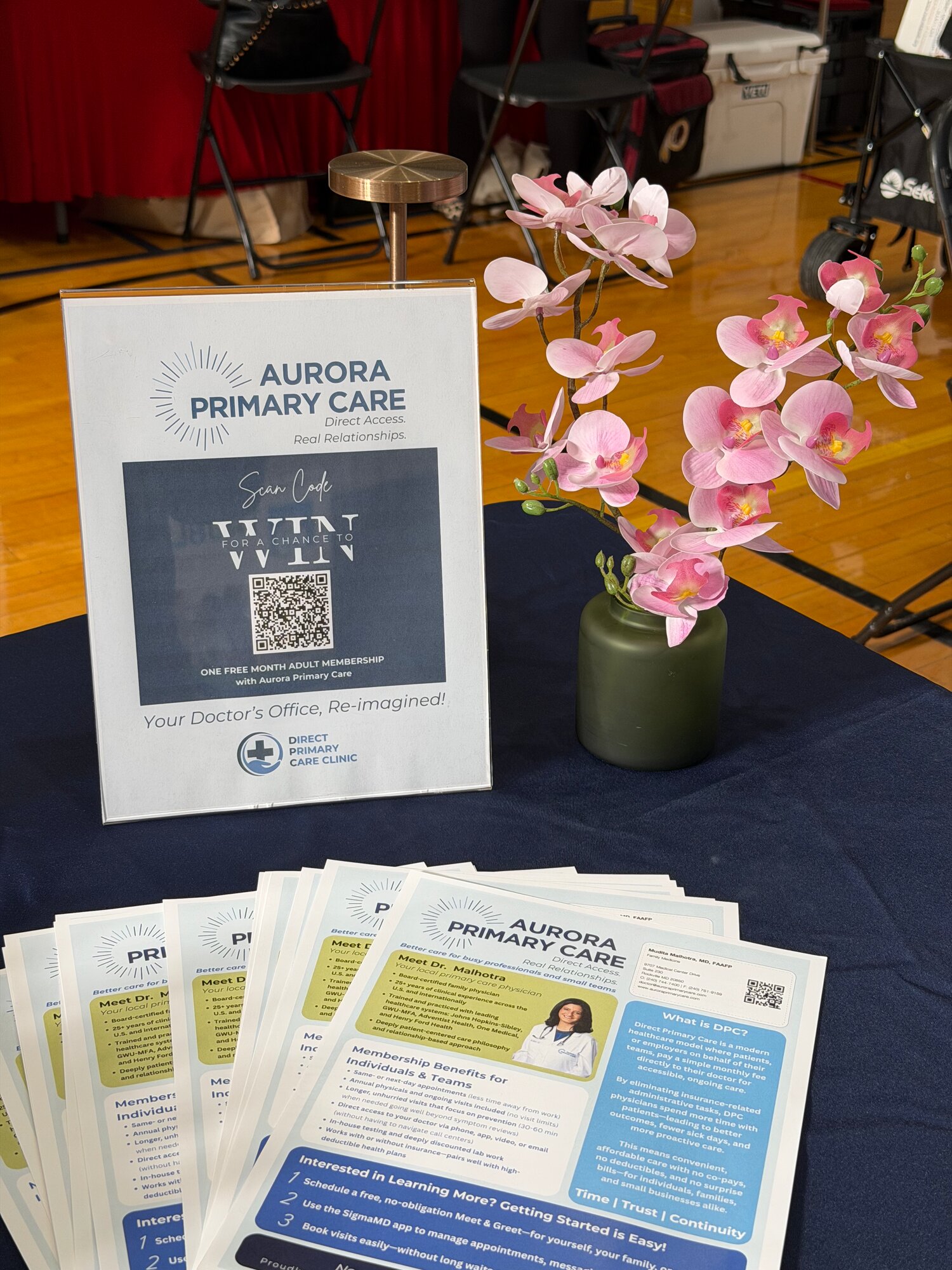 Aurora Primary Care raffle sign and employer flyers on the Aurora table at the Rockville Chamber Business & Community Expo