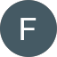 Circular blue-gray icon with a white uppercase letter F in the center.