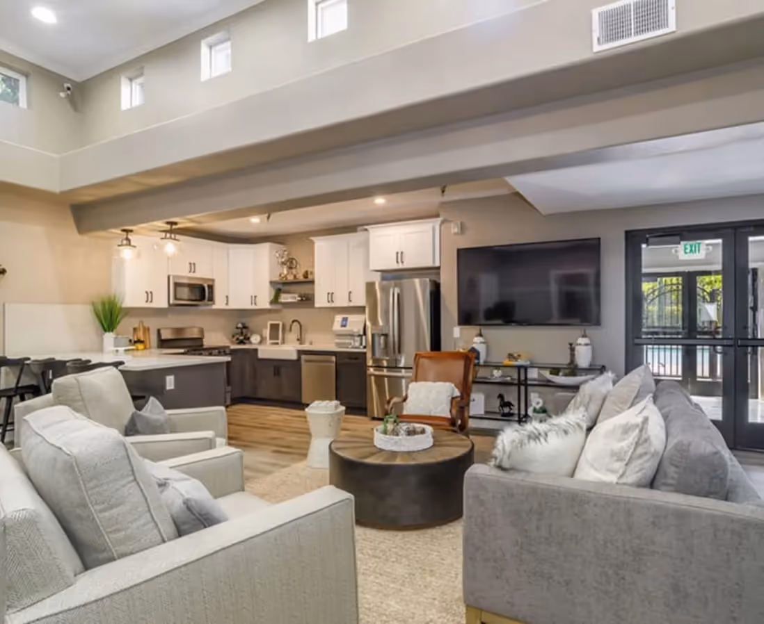 Staged apartment with view of living room and kitchen