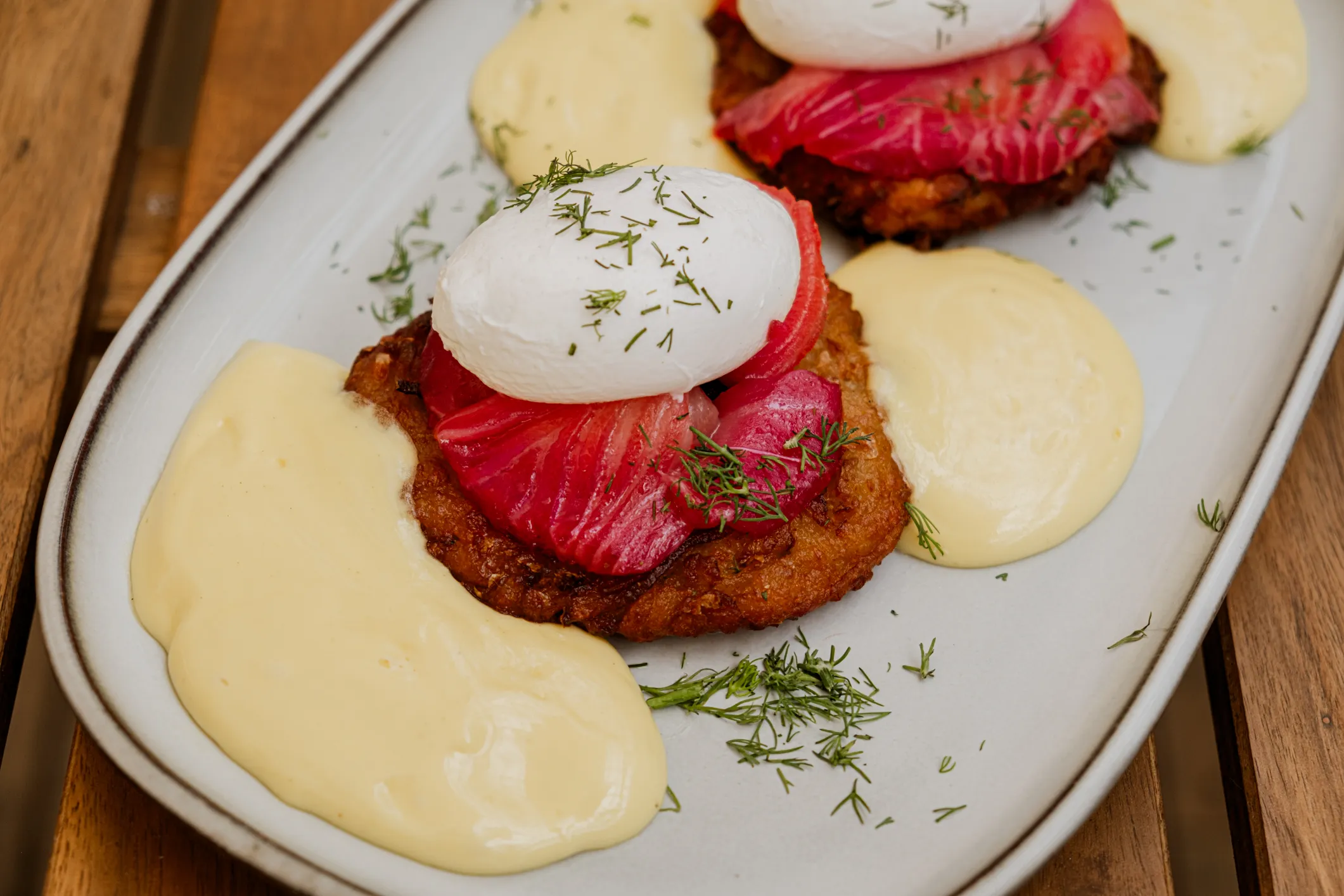 Sunday brunch at Kingston Nord — potato latkes topped with beet-cured salmon, poached eggs, hollandaise, and fresh dill