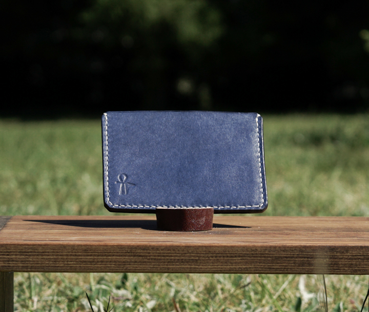 This card holder can easily hold 4-5 cards in addition to folded cash.