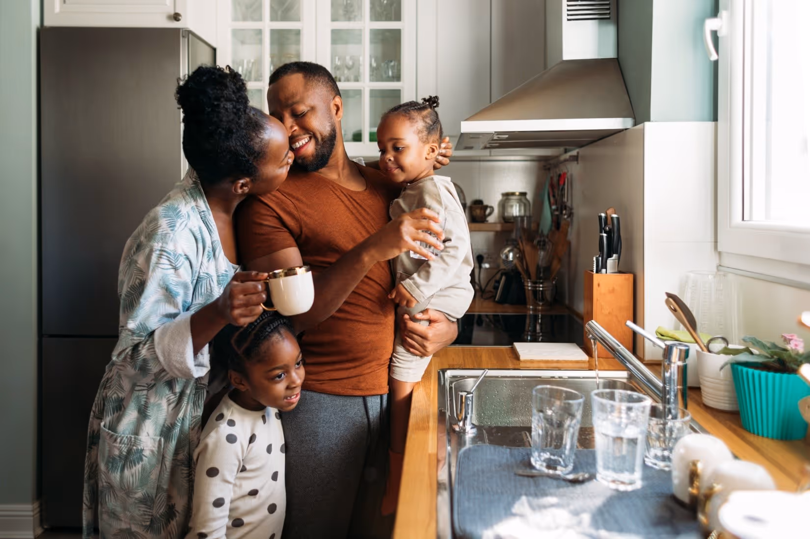 Family Enjoying Each Other in a Kitchen