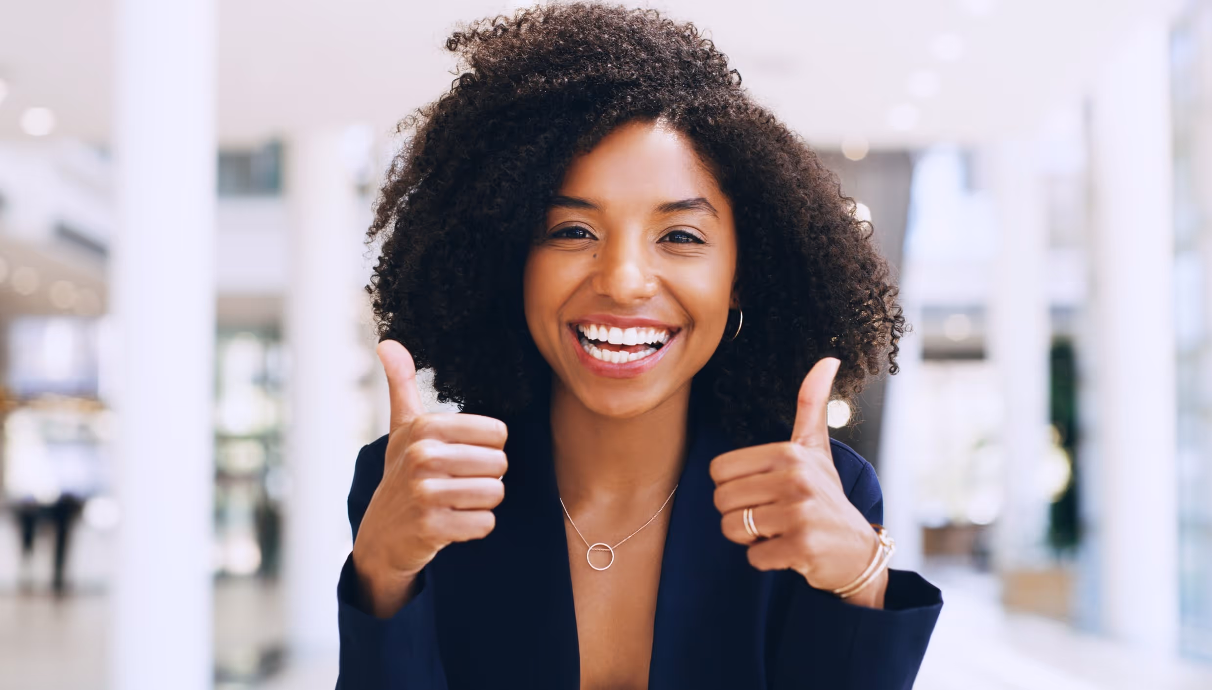 Joyfully Smiling Lady Giving 2 Thumbs Up
