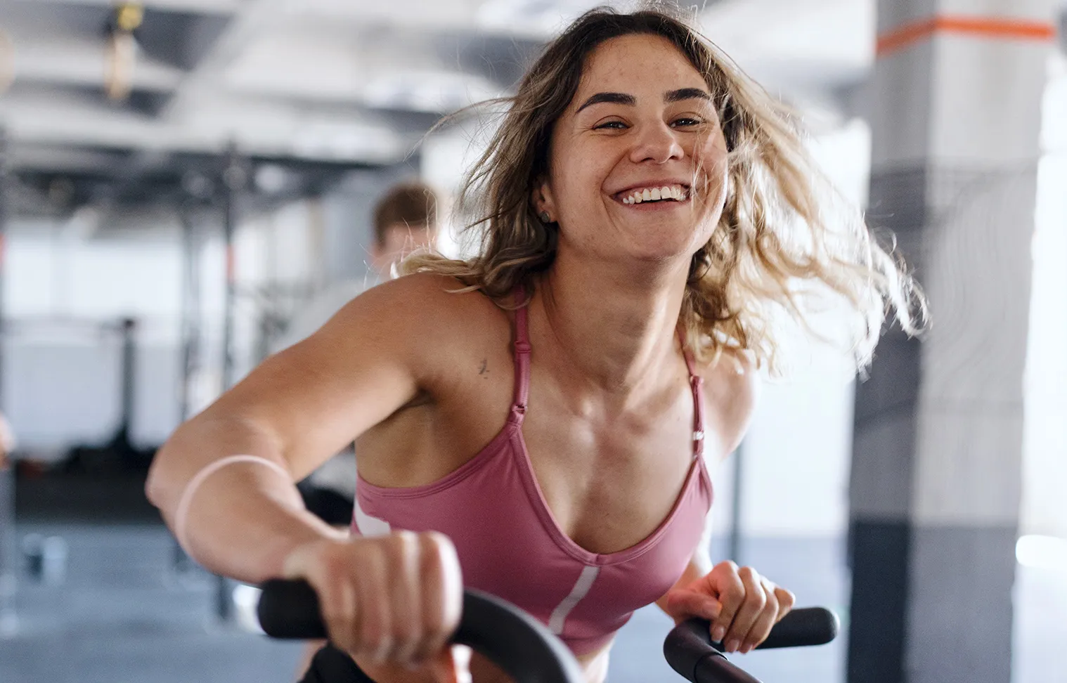 Woman enjoying a workout on a gym bike