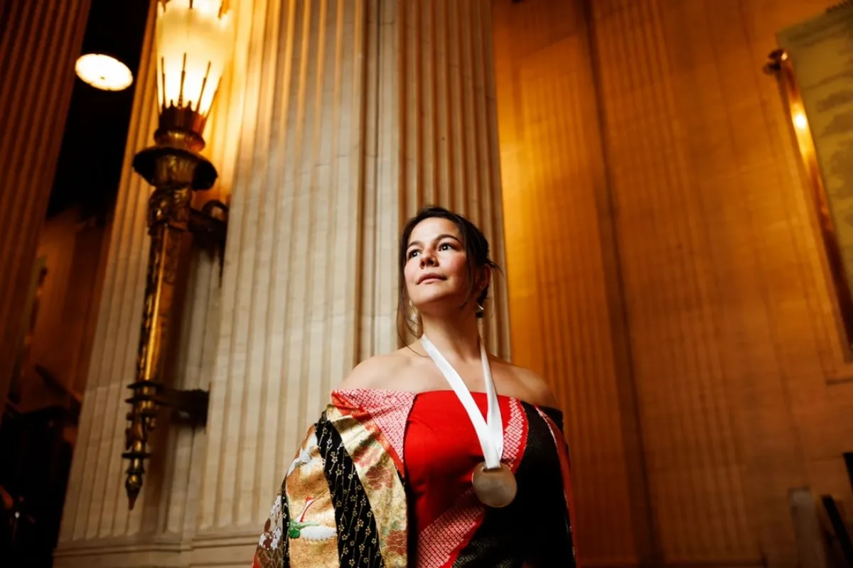 Julia Momosé holding the James Beard Award medal