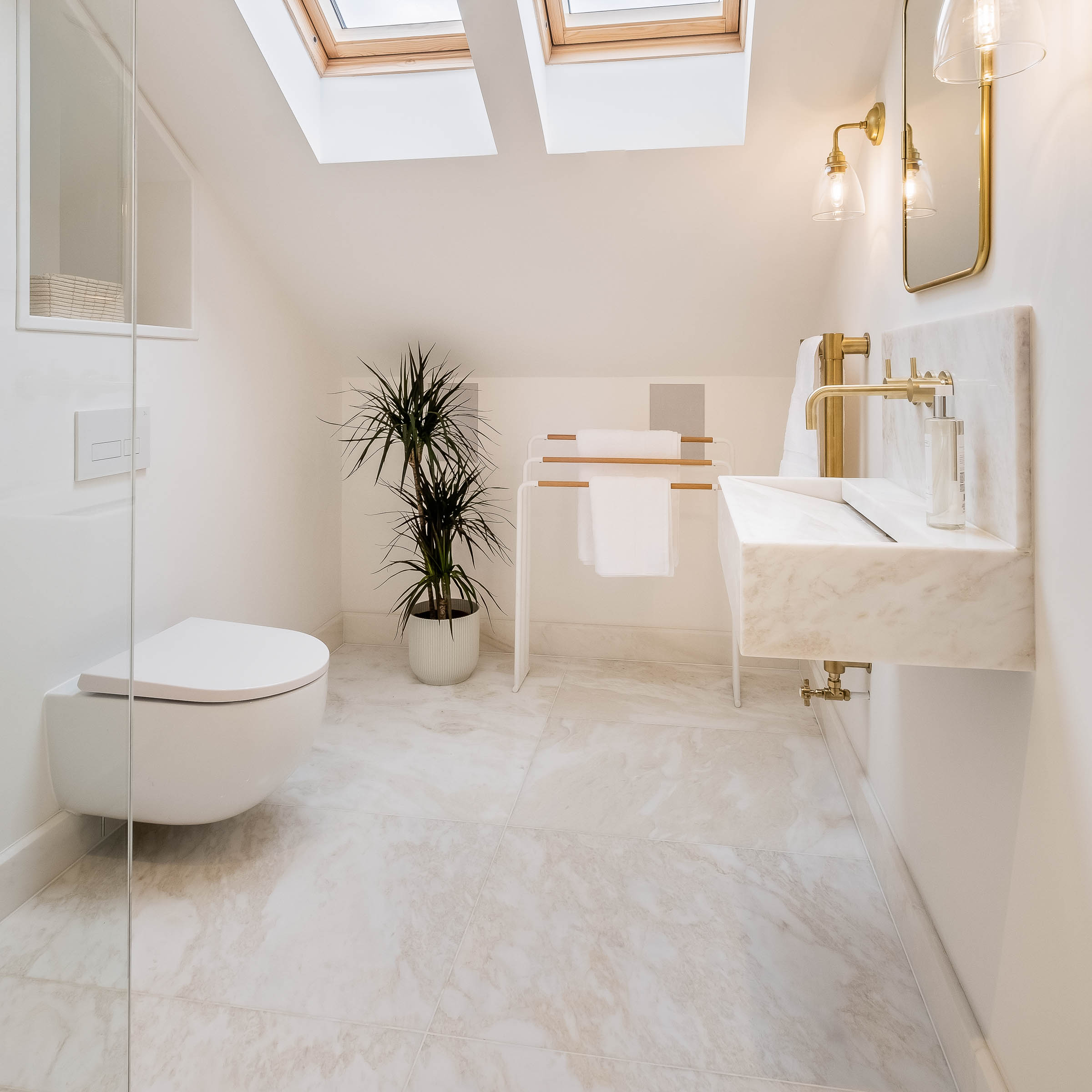 Handcrafted natural stone bathroom designed, fabricated and installed by Coulon Stone