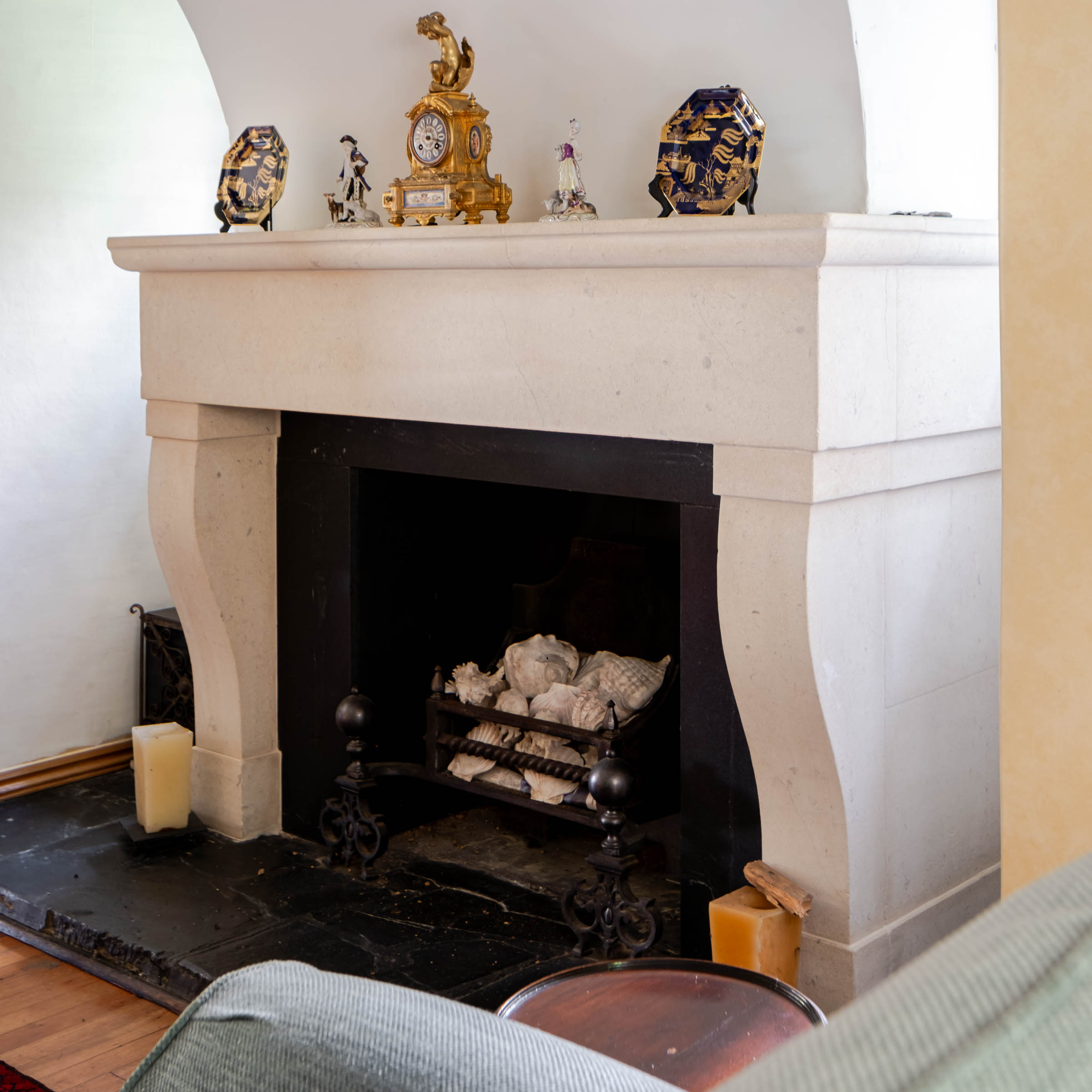 Bespoke natural stone fireplace custom designed and handcrafted by Coulon Stone