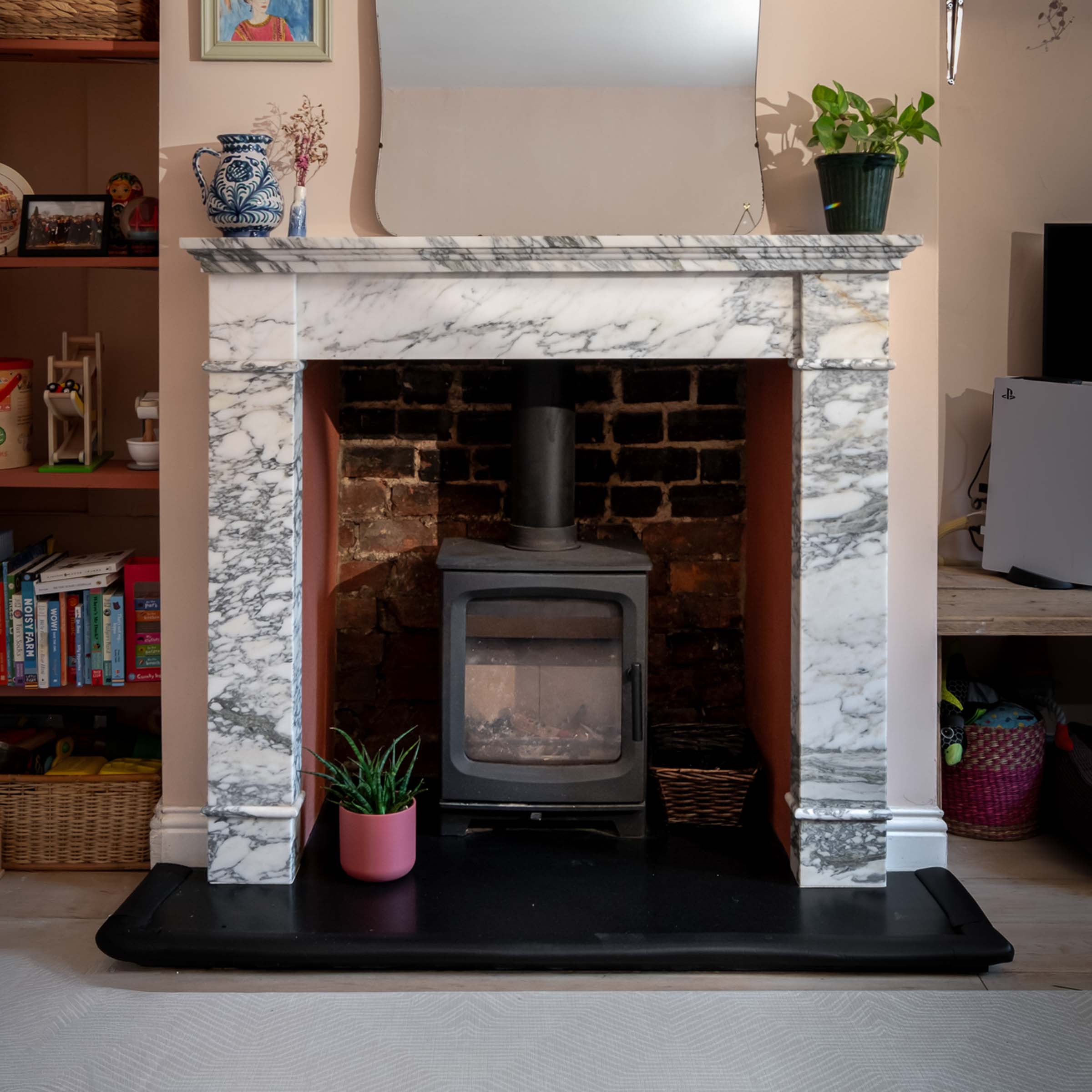 Bespoke natural stone fireplace custom designed and handcrafted by Coulon Stone