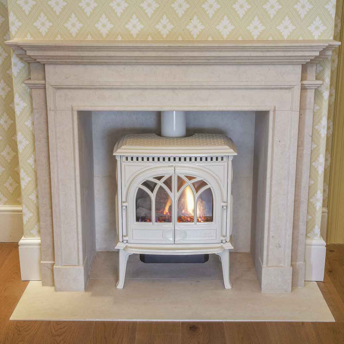 Bespoke natural stone fireplace custom designed and handcrafted by Coulon Stone