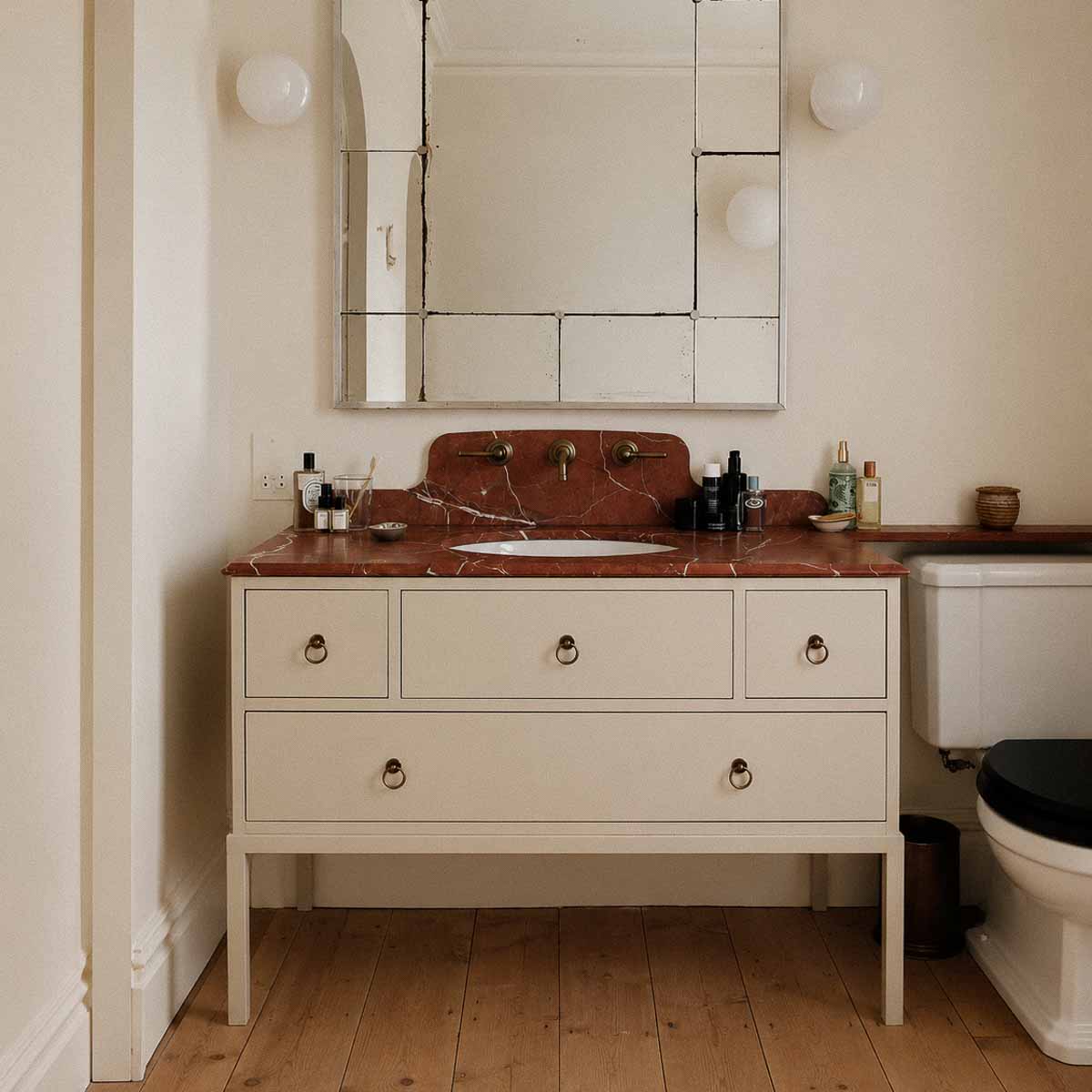Marble bathroom with integrated vanity and floor-to-ceiling stone wall cladding