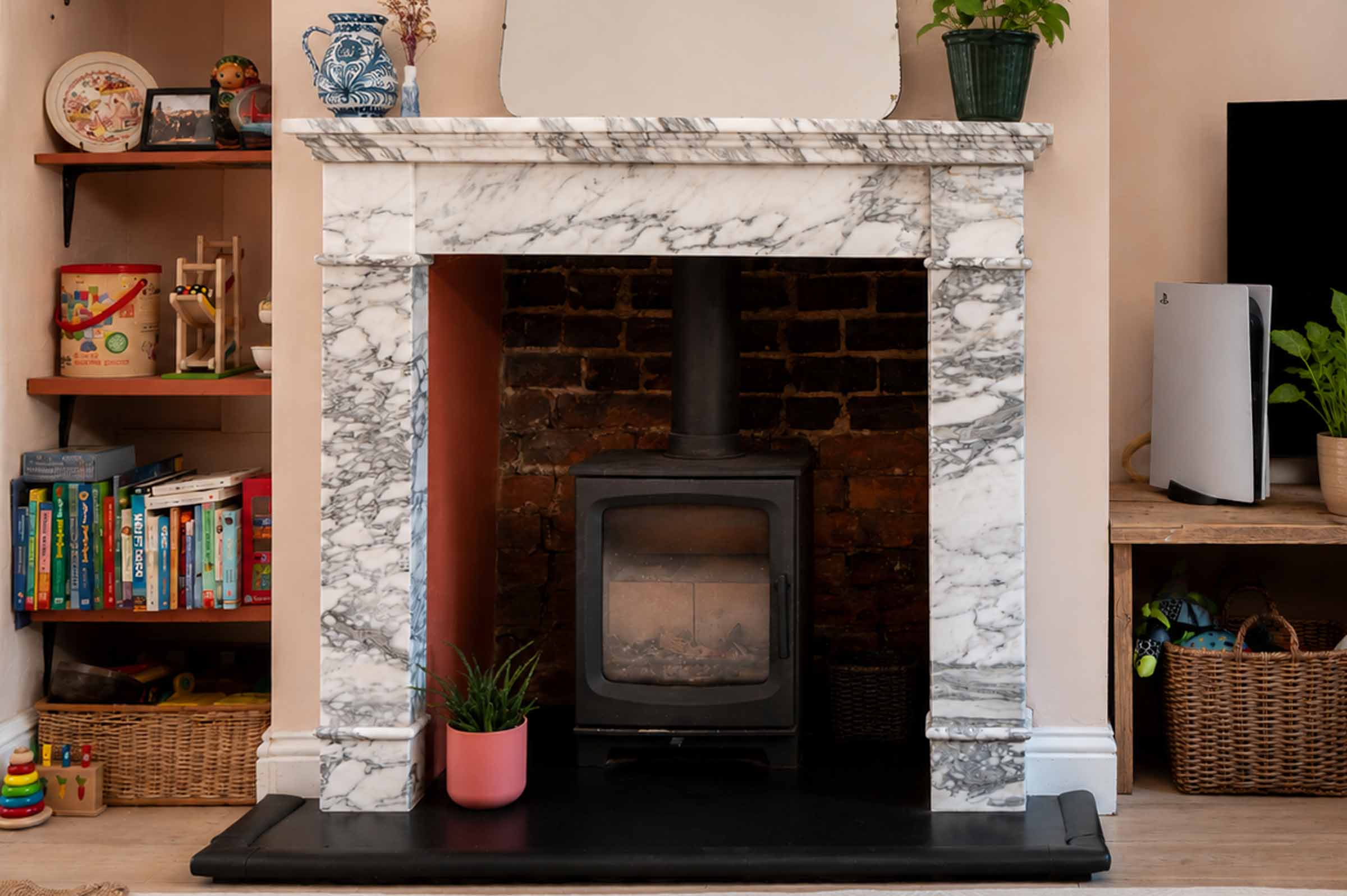 Bespoke natural stone fireplace custom designed and handcrafted by Coulon Stone