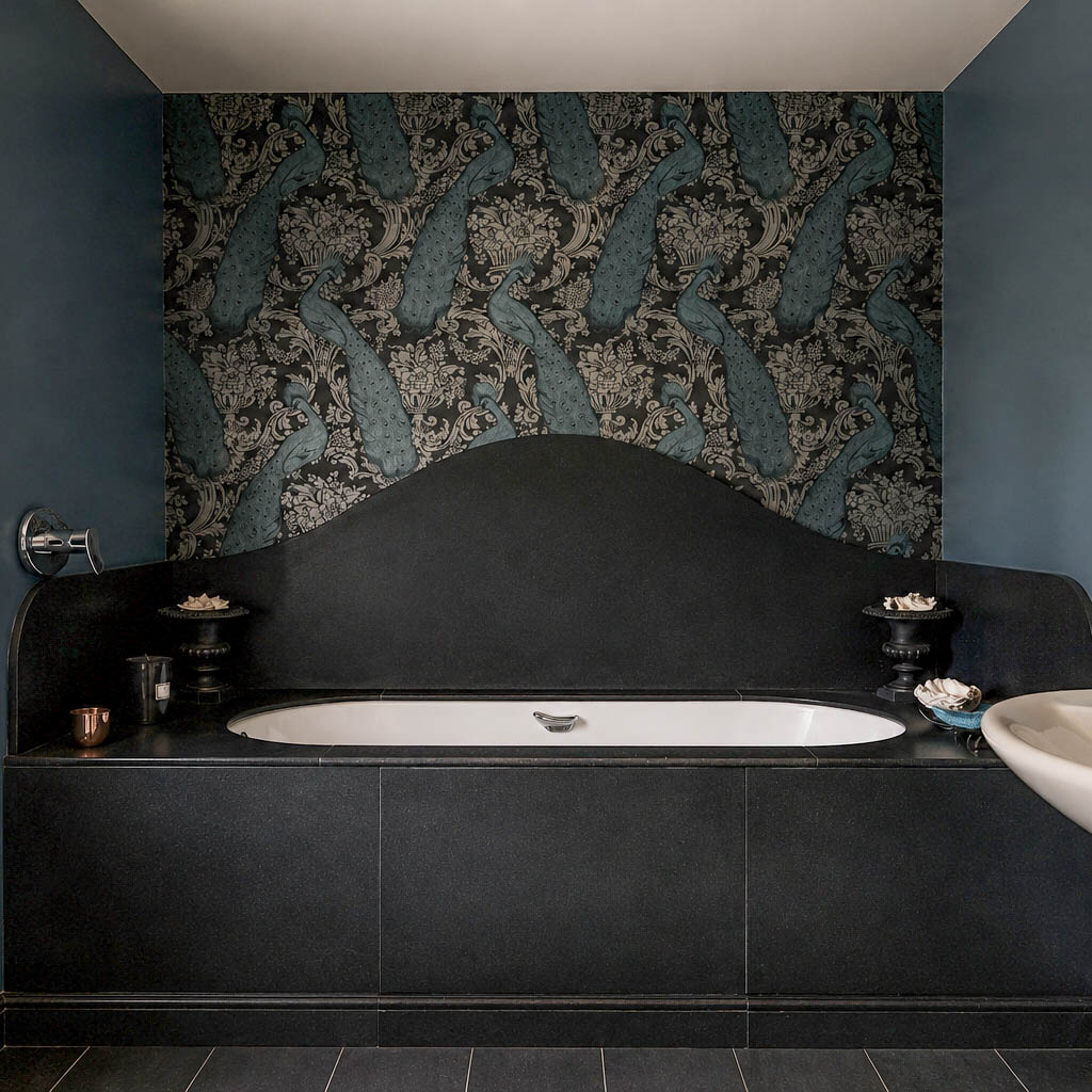 Bespoke stone bath surround with curved backsplash in a luxury bathroom
