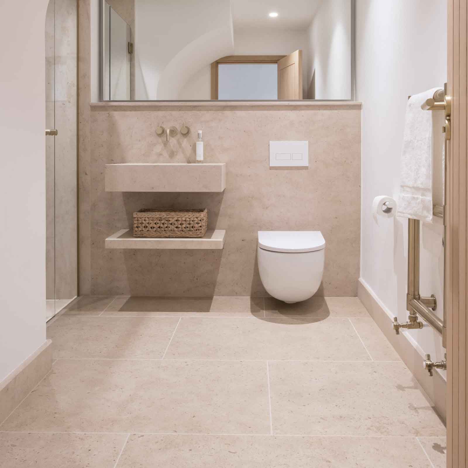 Bespoke natural stone bathroom designed and installed by Coulon Stone