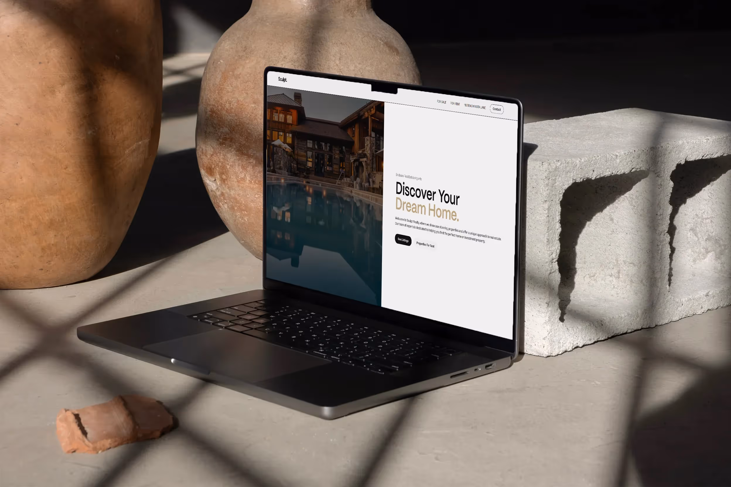 macbook on the floor showing a case study website