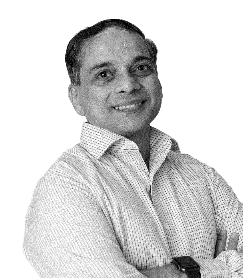 Smiling man with folded arms wearing a striped shirt and a smartwatch on his left wrist.