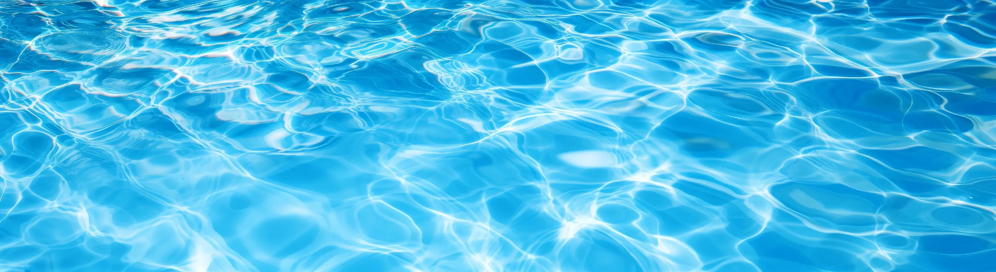Underwater panorama of swimming pool water with sun reflections, panoramic banner background