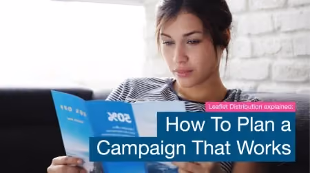 A woman carefully reviewing a blue promotional flyer, featuring a text overlay that reads "Leaflet Distribution explained: How To Plan a Campaign That Works."