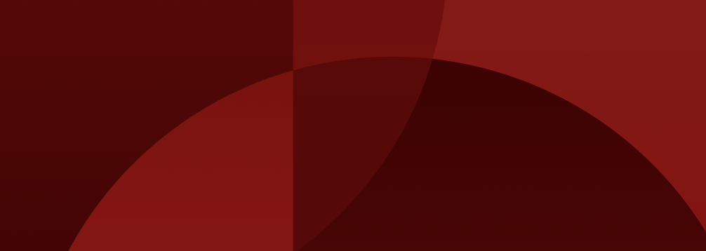 Abstract background with overlapping red and dark red geometric shapes including circles and rectangles.