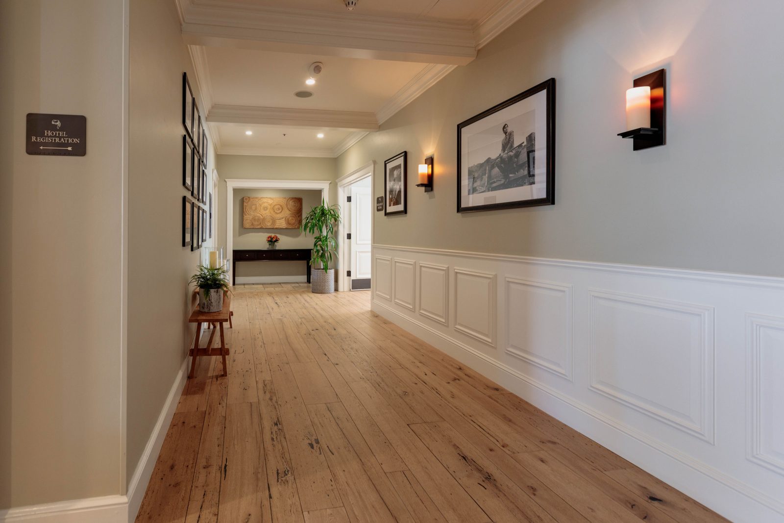 Long hallway with a light oak look floor by Brazil Floors