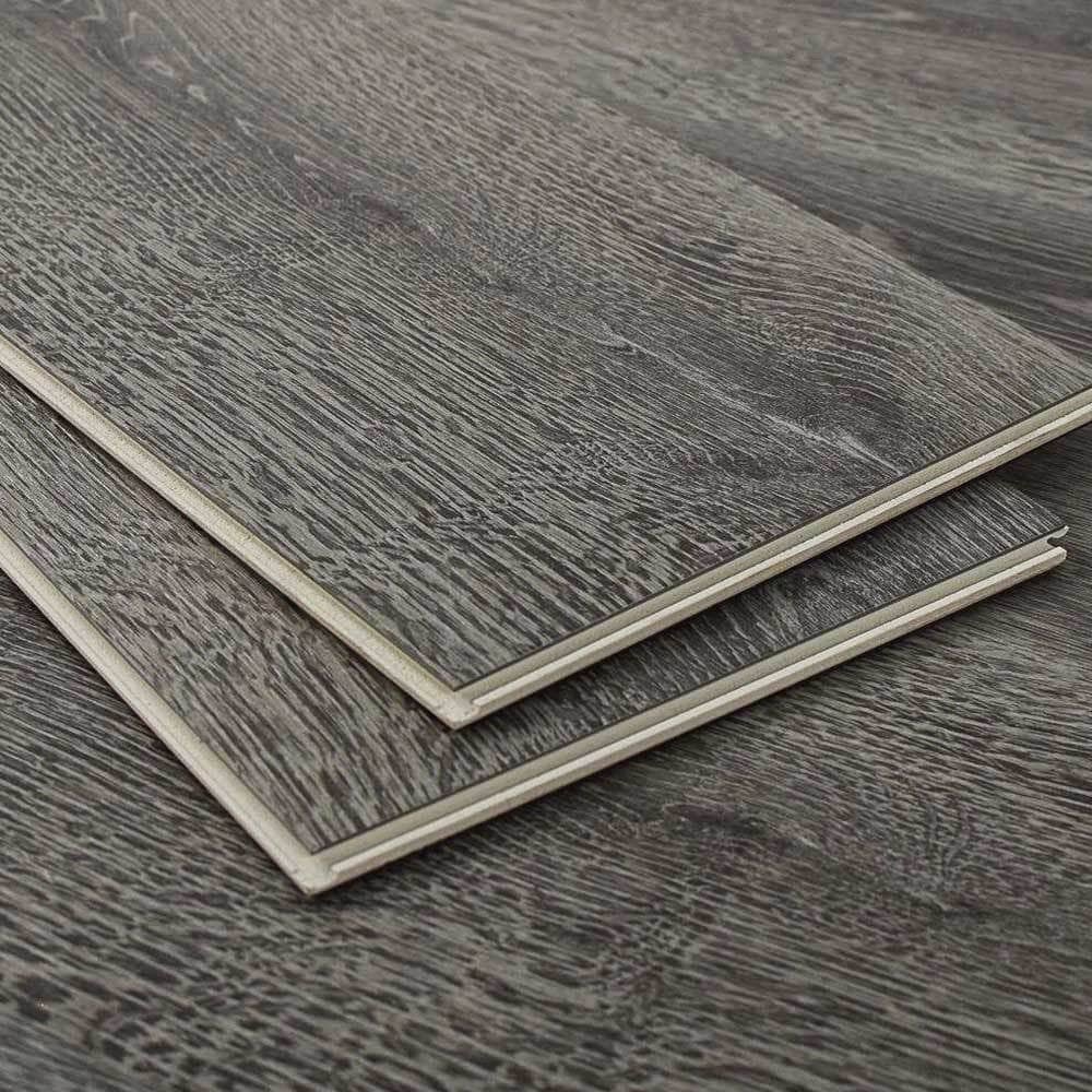 Gray vinyl plank samples showing the click edge, Brazil Floors