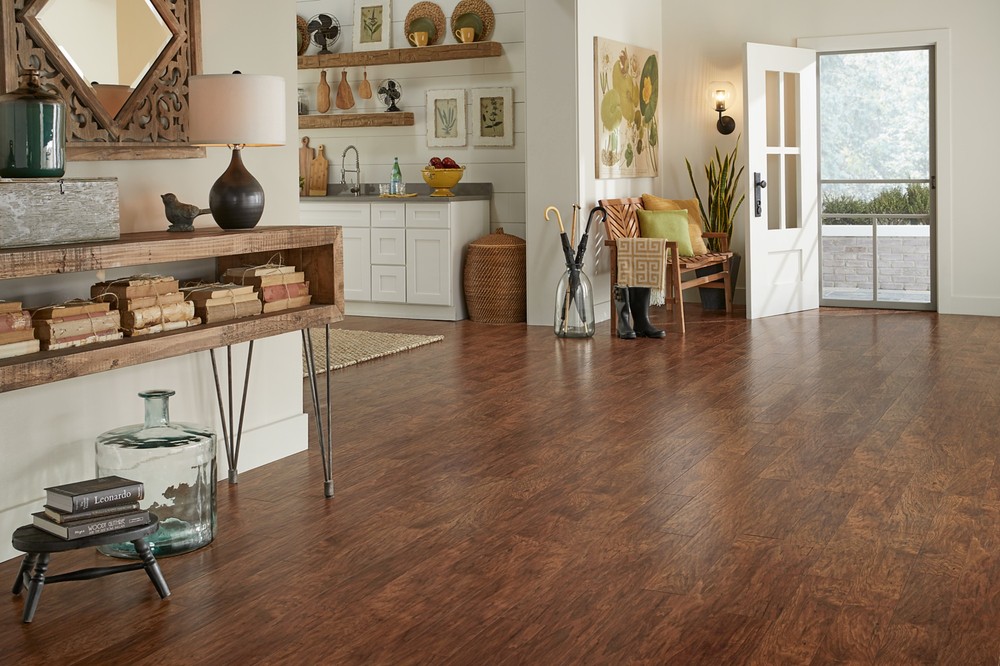 Toasted Chestnut Quick-Step Studio laminate in an open dining area by Brazil Floors
