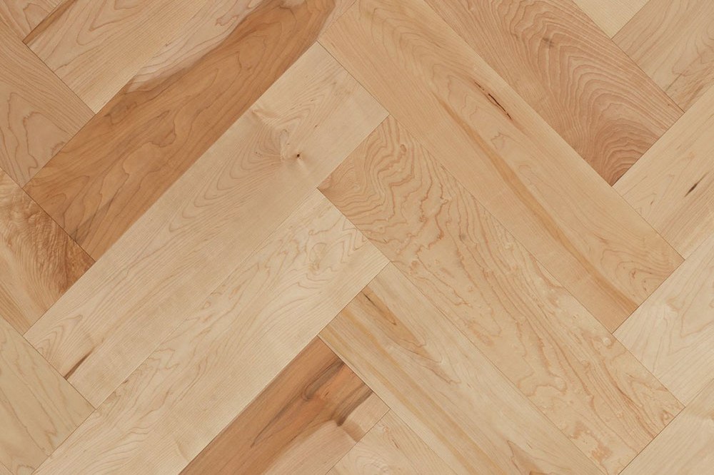 Pale hard maple hardwood laid in a herringbone pattern, Brazil Floors