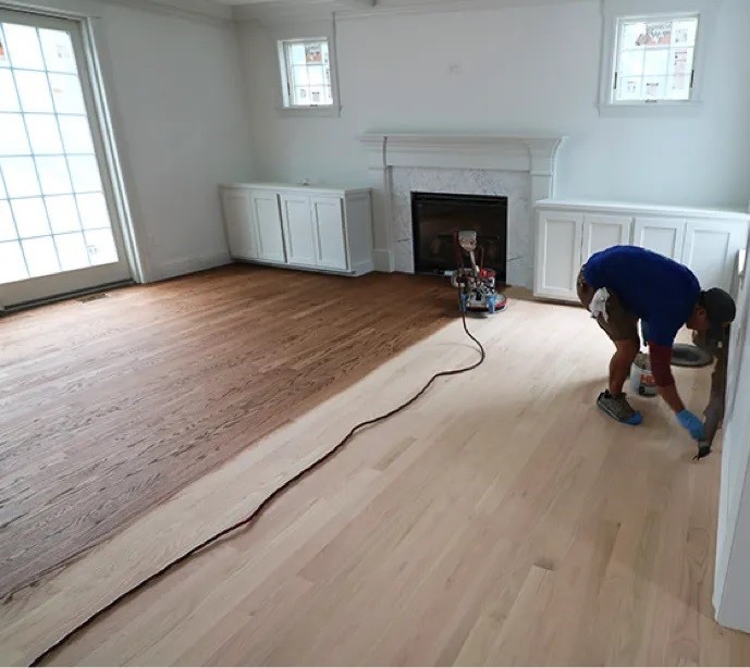Edging along the walls while sanding a living room floor in Johnston, RI