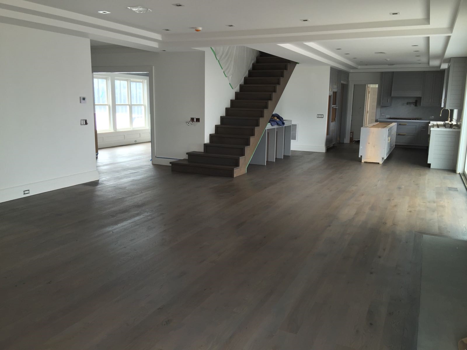 Empty home with new dark hardwood floors installed