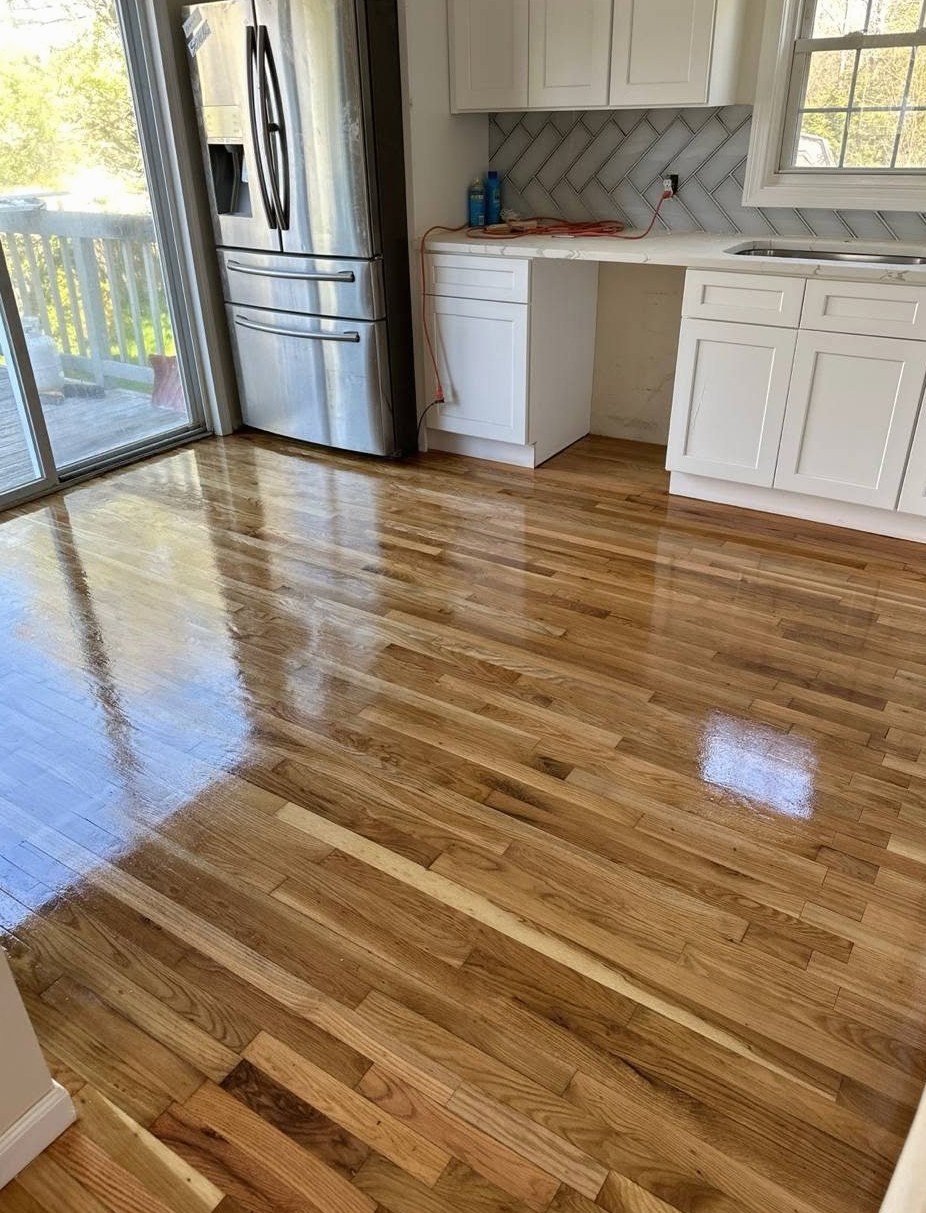 Glossy oak floor installed in a white Glocester kitchen, Brazil Floors