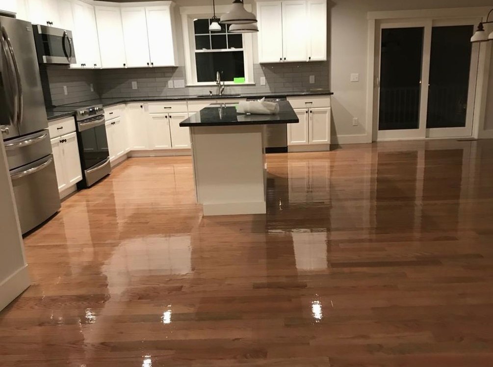 Gleaming refinished oak in a white kitchen for a Central Falls family, Brazil Floors