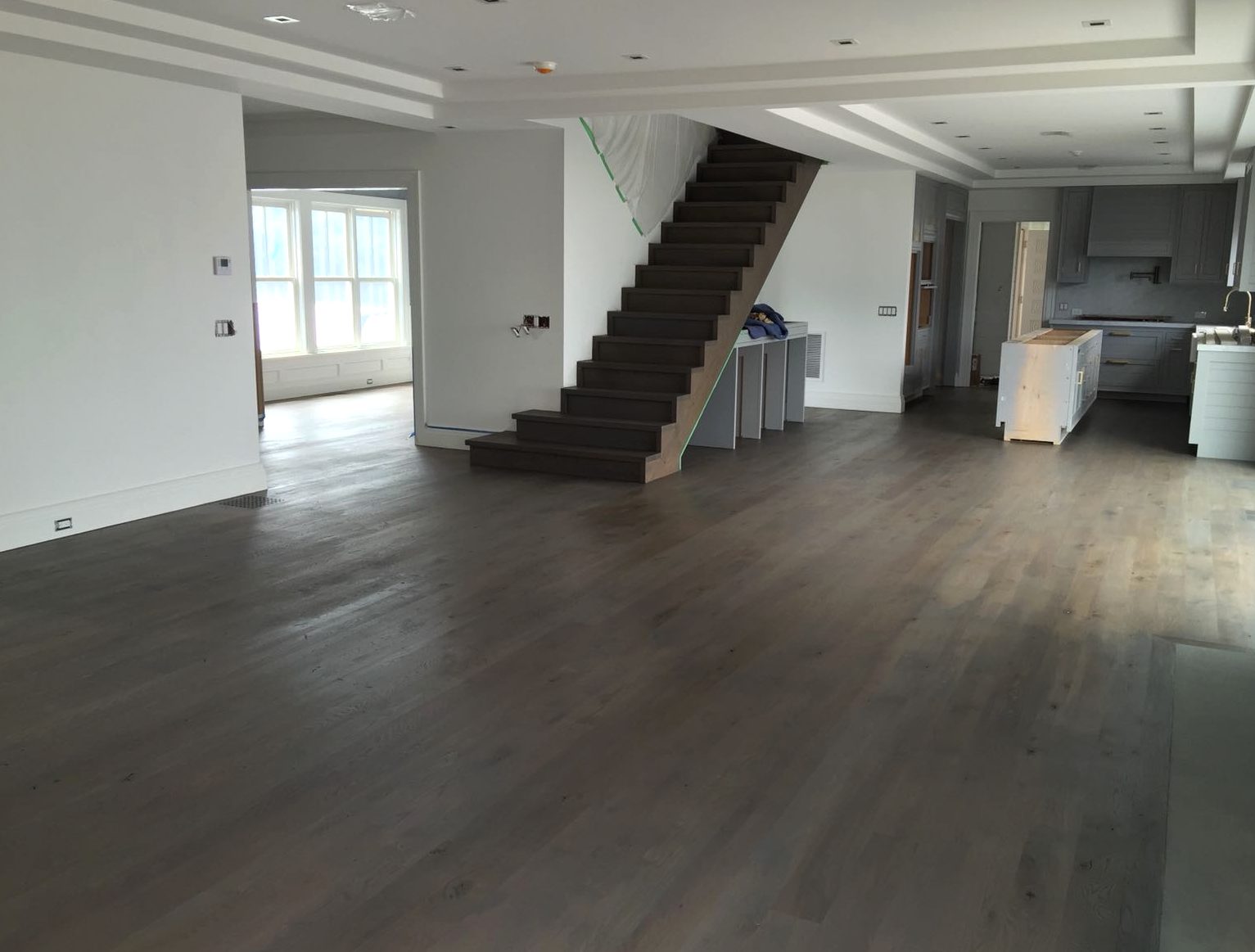 Sanded and restained wood floor across an open plan in Coventry, Brazil Floors