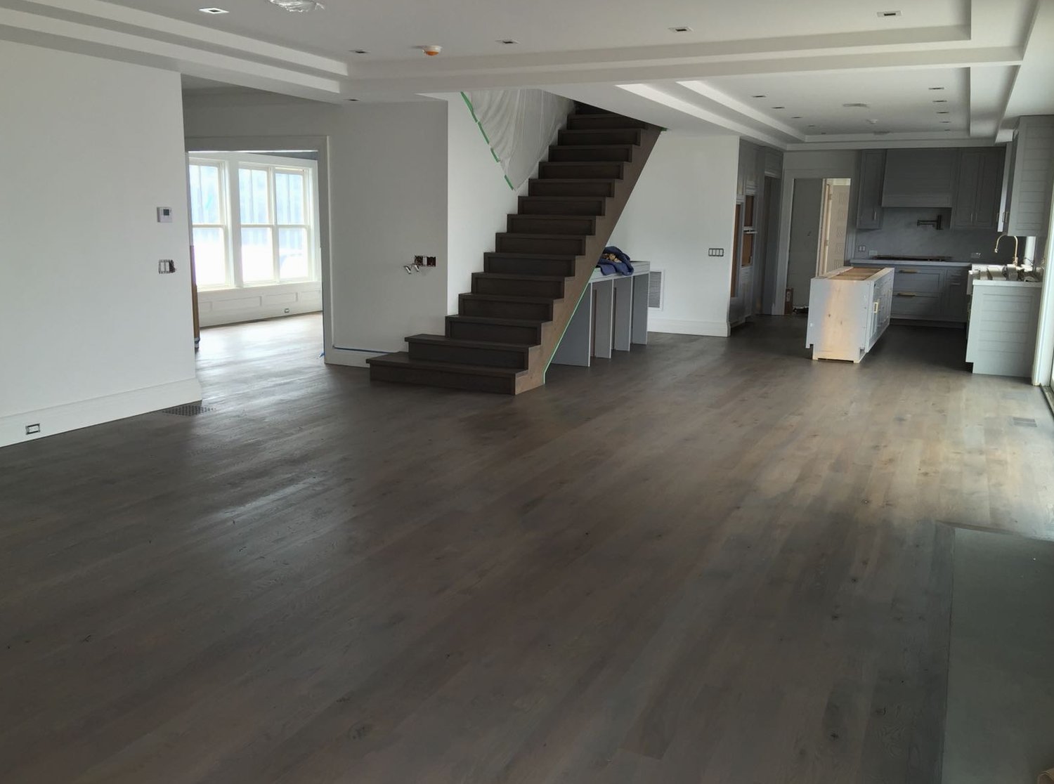 Sanded and restained oak floor on an open main level inside a Little Compton home, Brazil Floors