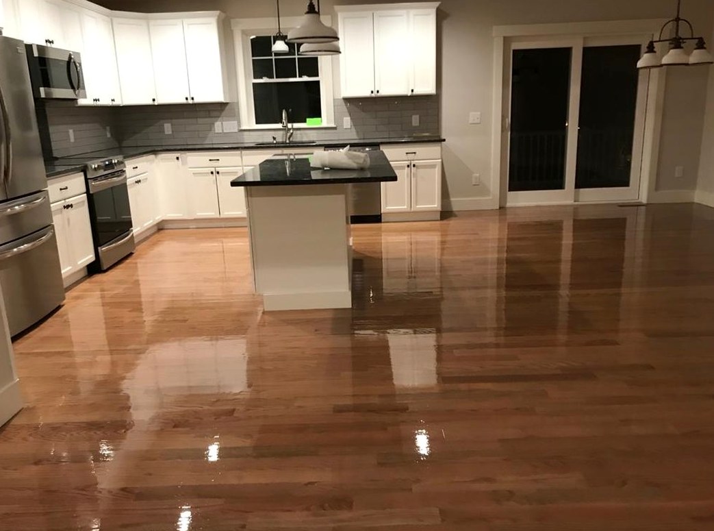 Recoated oak boards beside white cabinetry in a home close to College Hill, Brazil Floors