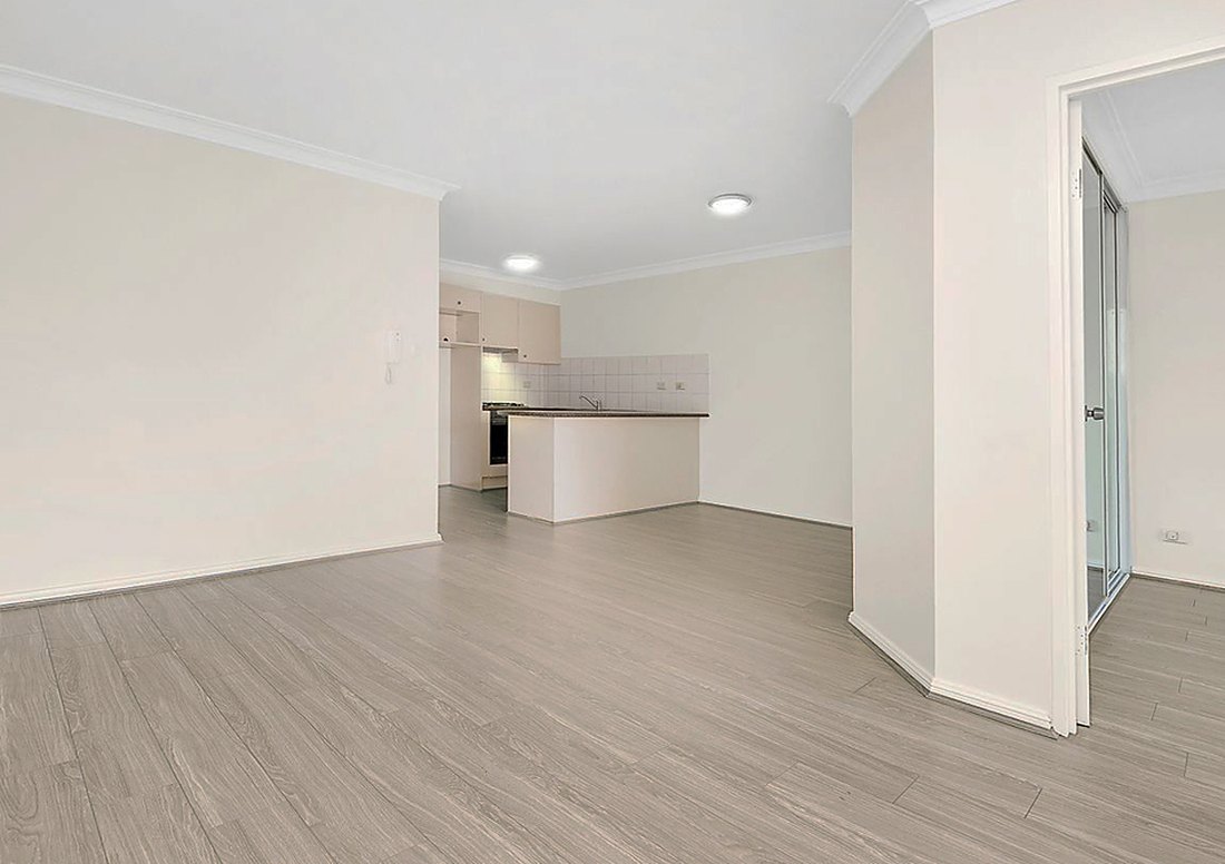 Light gray laminate in an empty living room near Sakonnet Point, Brazil Floors